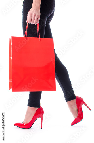 Woman walking with a shopping bag