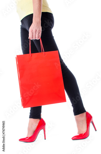 Woman walking with a shopping bag