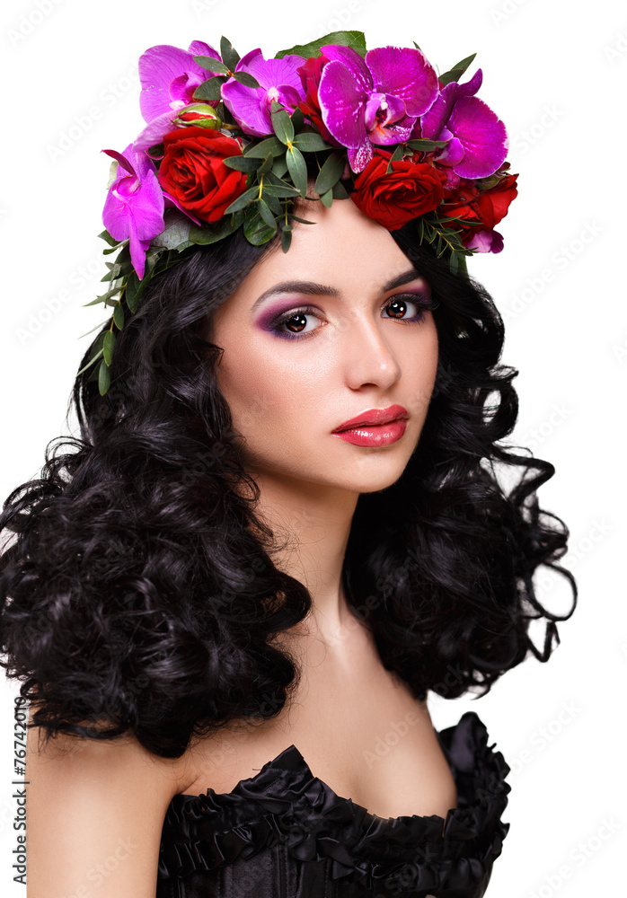 beautiful girl with a wreath of orchids on head. 