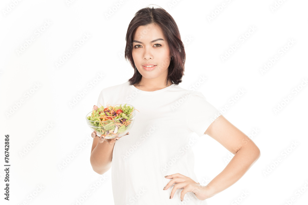 Pretty girl eating fresh vegetable salad Pretty girl eating fresh vegetable salad