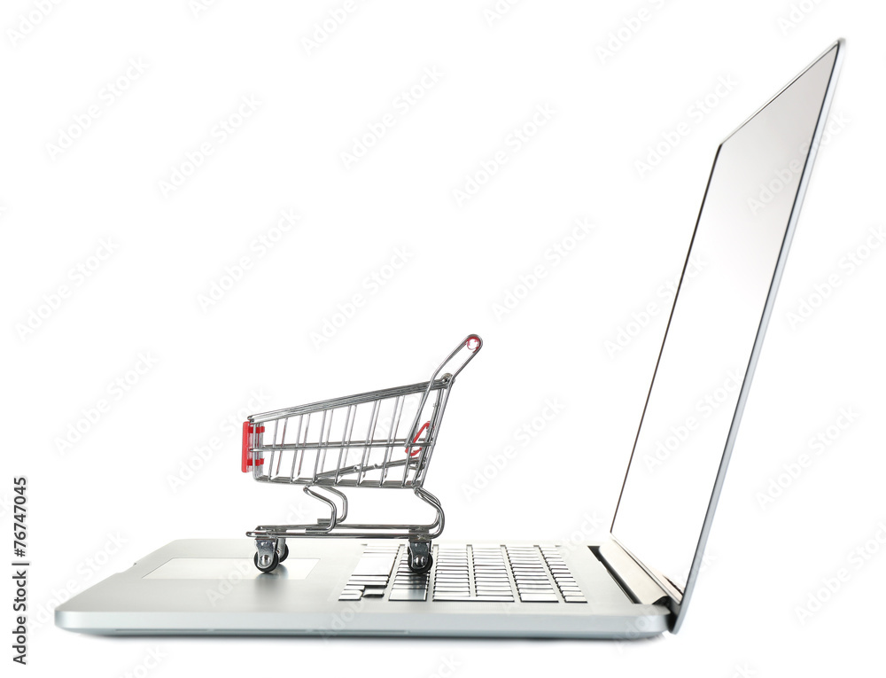 Laptop with small shopping cart isolated on white background Laptop with small shopping cart isolated on white background