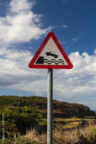 Quayside or river bank triangular warning sign, united kingom.