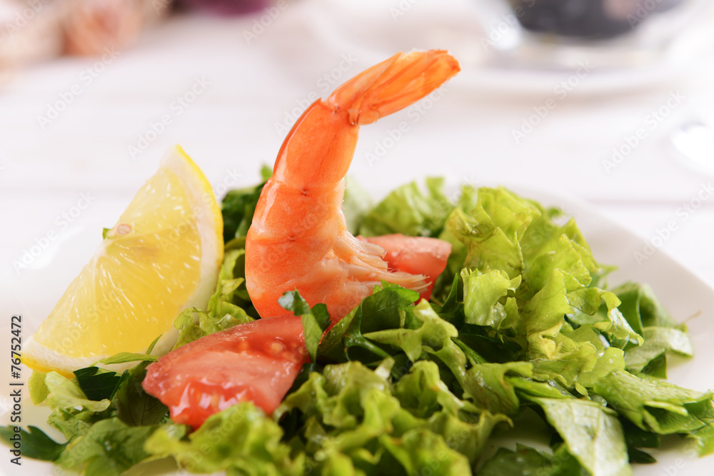Tasty seafood on plate on table close-up Tasty seafood on plate on table close-up