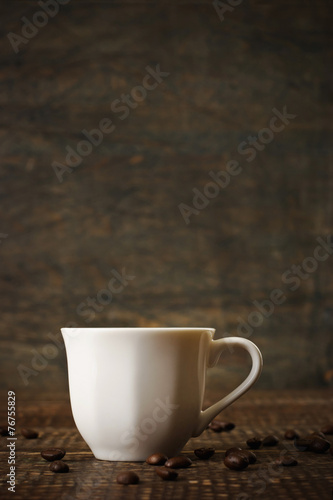 White porcelain coffee cup on the wooden table