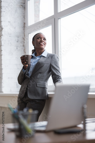 Business woman enjoying the coffee break