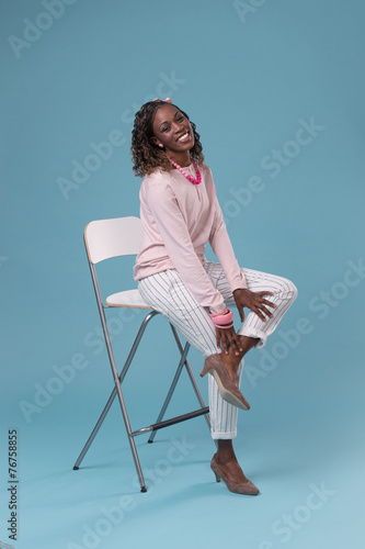 African woman sitting on a chair
