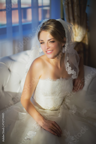 beautiful bride sitting in a room