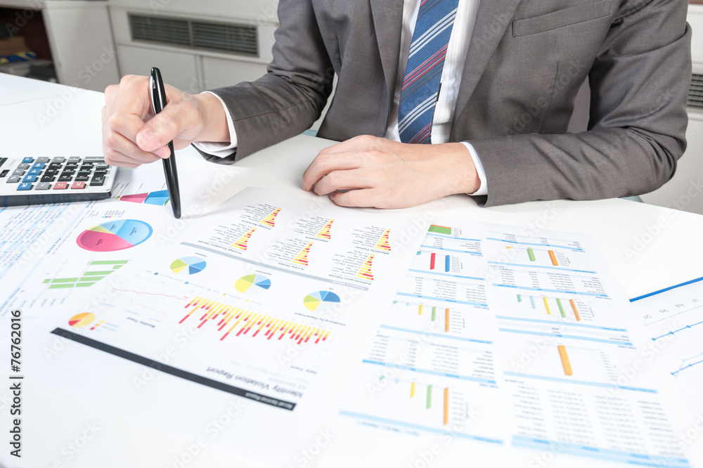 Businessman show analyzing report, business performance concept Businessman show analyzing report, business performance concept