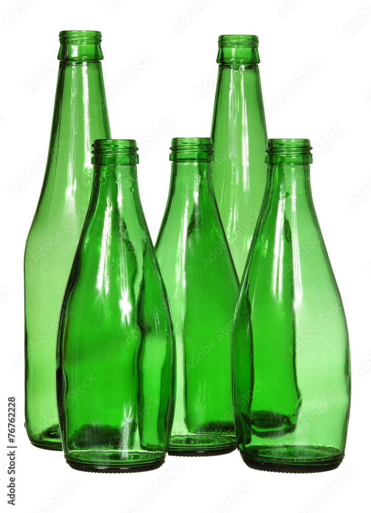 Five green glass bottles isolated on white background Five green glass bottles isolated on white background
