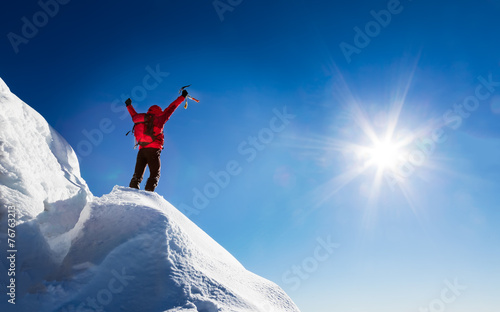 Mountaineer celebrates the conquest of the summit.