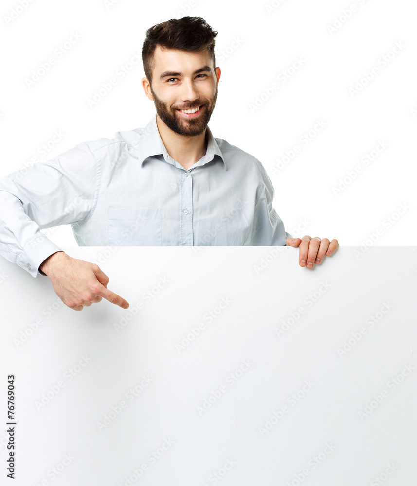 A young bearded man showing blank signboard, isolated over white A young bearded man showing blank signboard, isolated over white