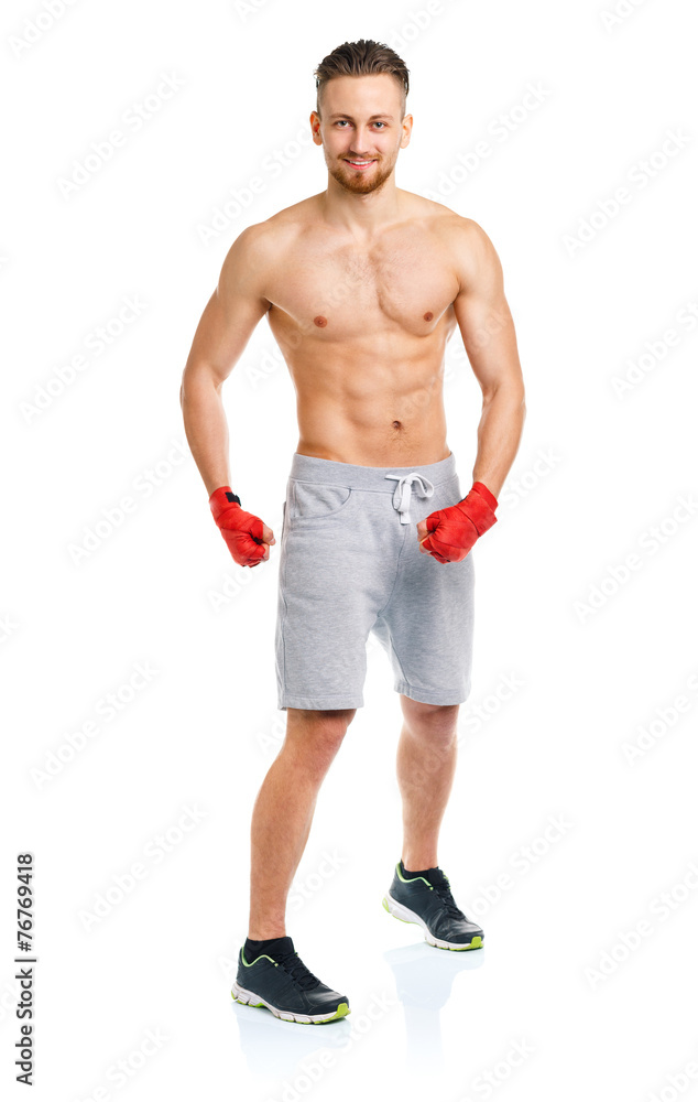 Athletic attractive man wearing boxing bandages on the white Athletic attractive man wearing boxing bandages on the white