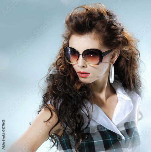 Wallpaper Mural fashion shot of girl with sunglasses posing in light background  Torontodigital.ca