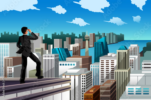 Businessman standing on a rooftop