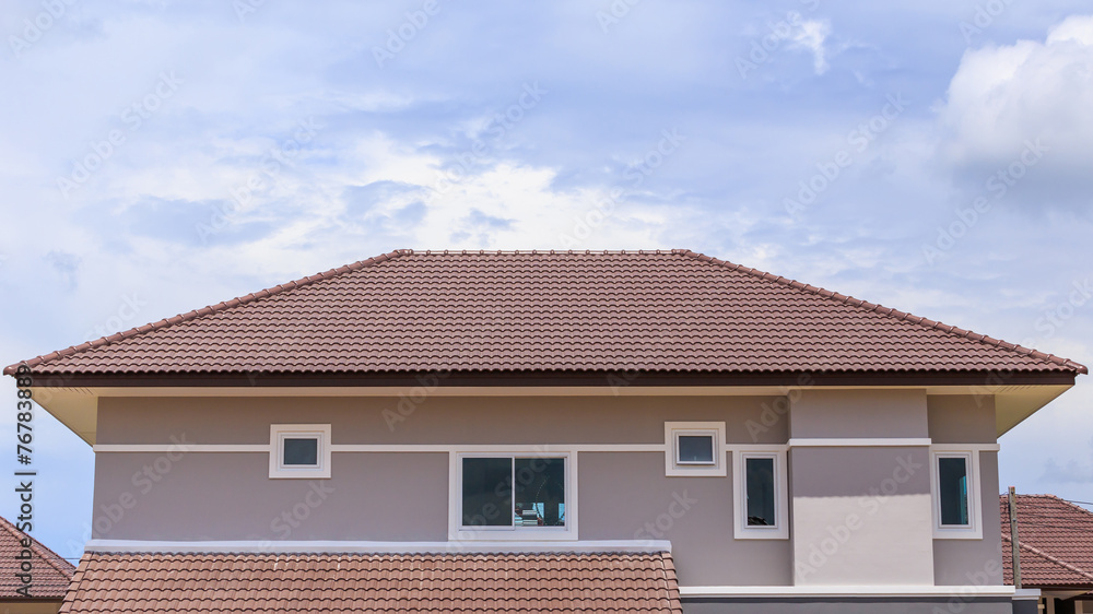 roof under construction with stacks of roof tiles for home build