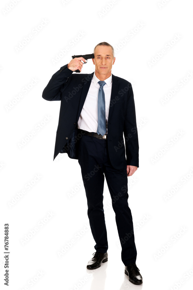 Full length mafia man with handgun near head Full length mafia man with handgun near head