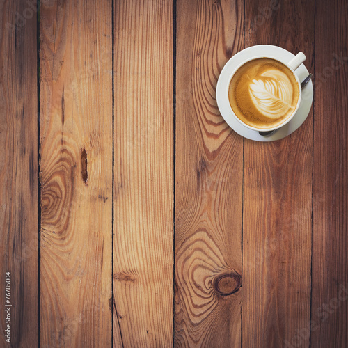 Latte coffee on wood with space