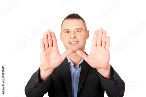 Businessman gesture stop sign with his hands