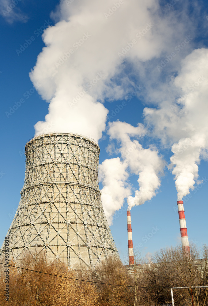 Day view of power plant, smoke from the chimney Day view of power plant, smoke from the chimney