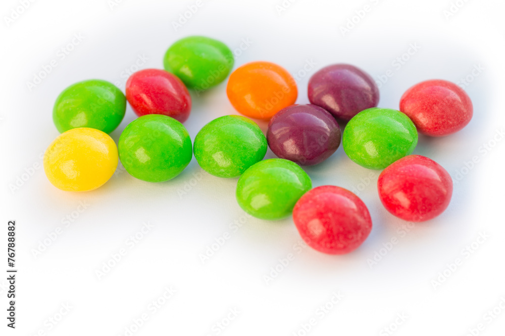 Colorful chewy dragee on a white paper. Colorful chewy dragee on a white paper.