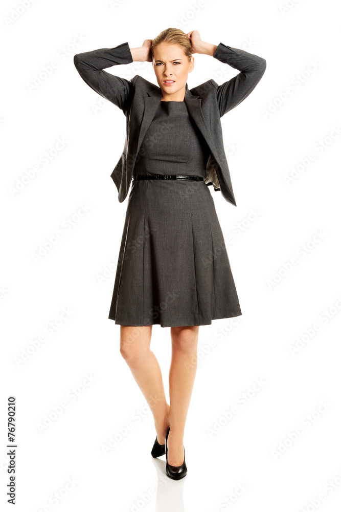 Angry businesswoman pulling her head Angry businesswoman pulling her head