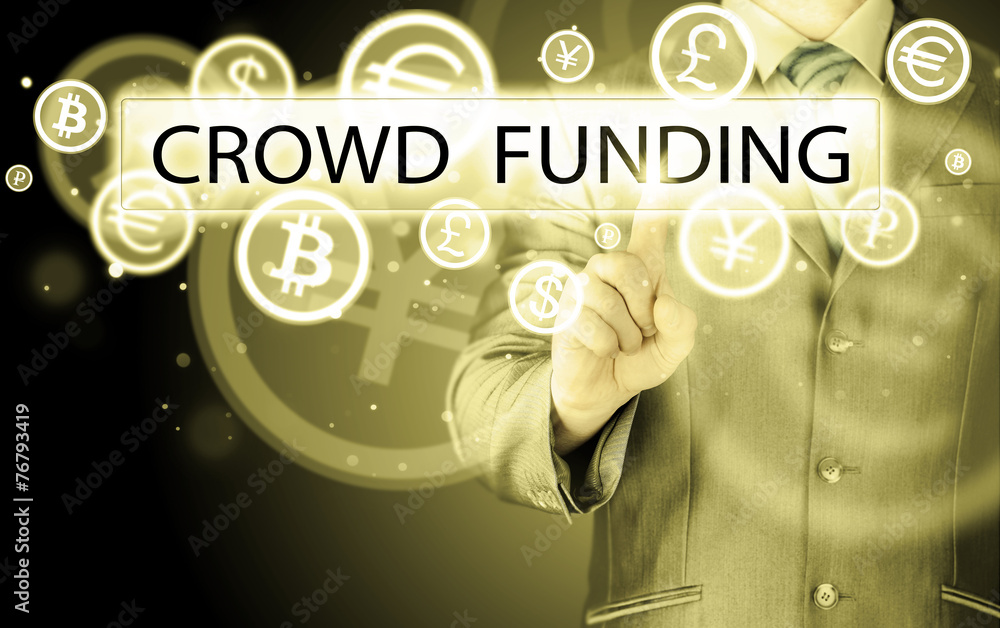 Businessman pushes virtual crowd funding button Businessman pushes virtual crowd funding button