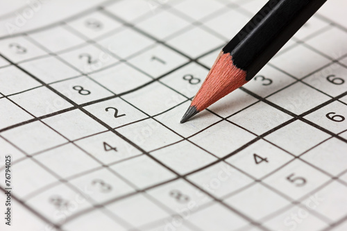 crossword sudoku and pencil, popular puzzle game with numbers