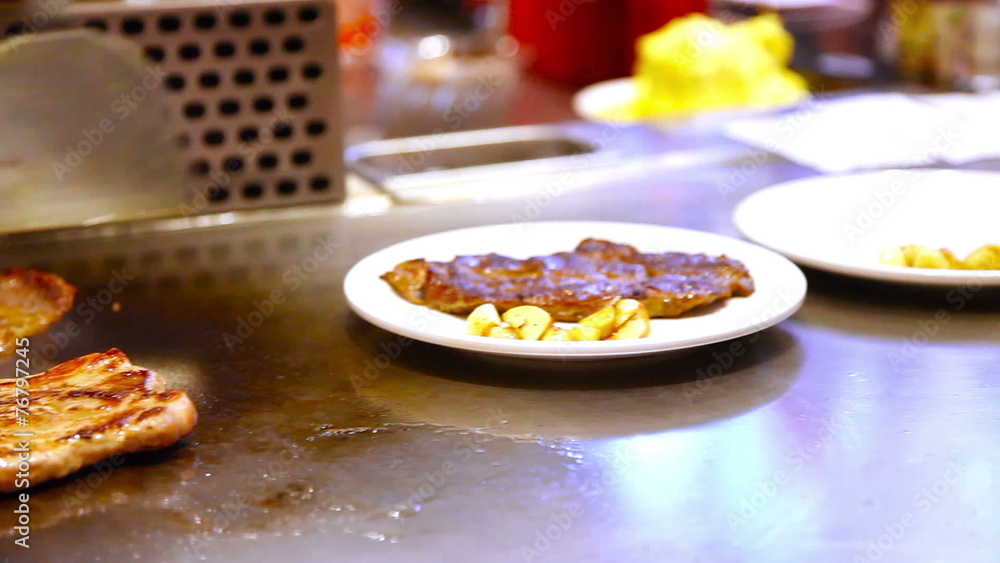 HD 1080p - Steaks grilling at a Chinese Hibachi restaurant HD 1080p - Steaks grilling at a Chinese Hibachi restaurant