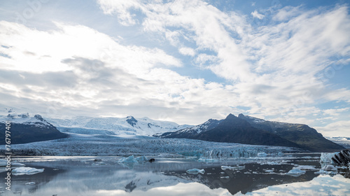 Glacier tonque and mountains in iceland, cloudy sky