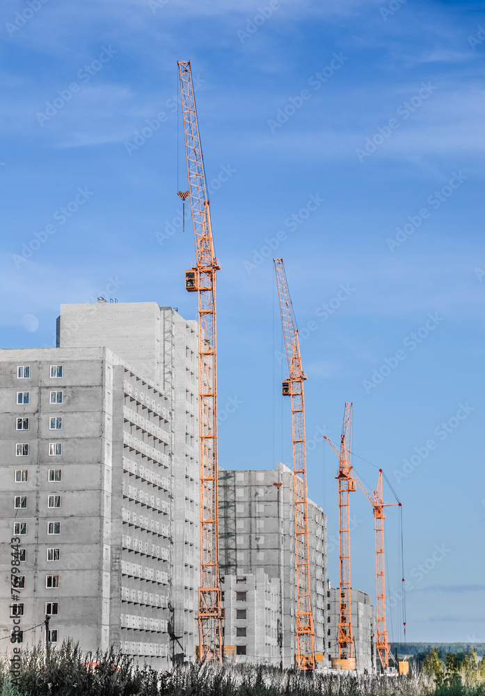 Building crane and building under construction Building crane and building under construction