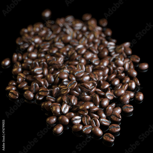 Roasted coffee beans on black background for advertising