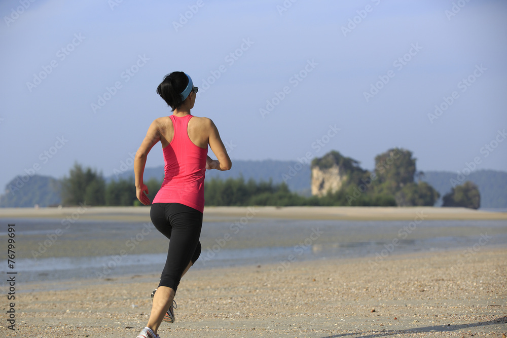 young woman running on sunrise beach young woman running on sunrise beach