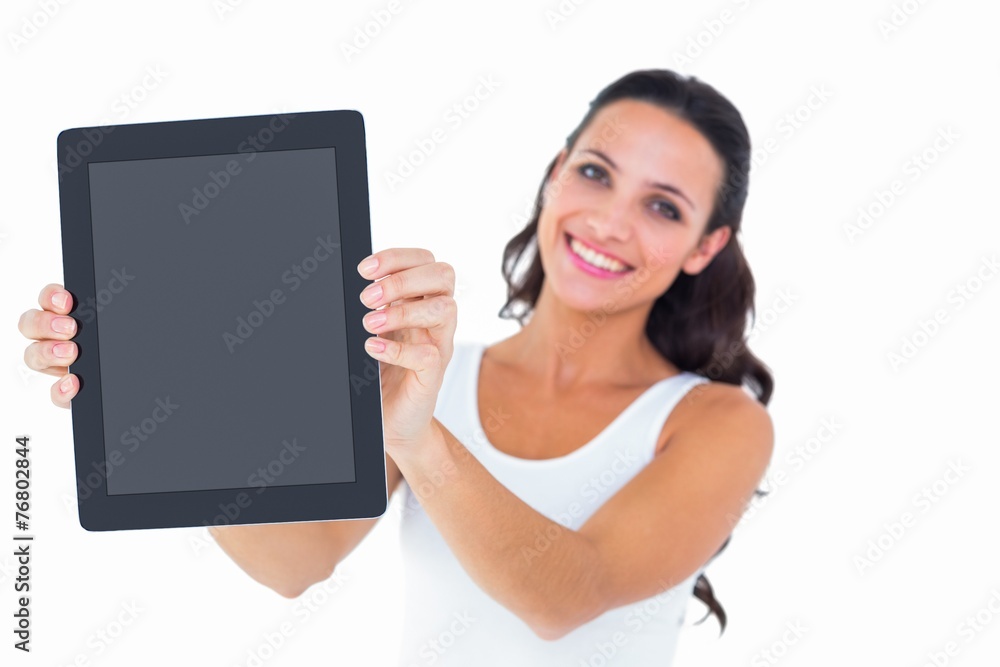 Pretty brunette using tablet pc Pretty brunette using tablet pc