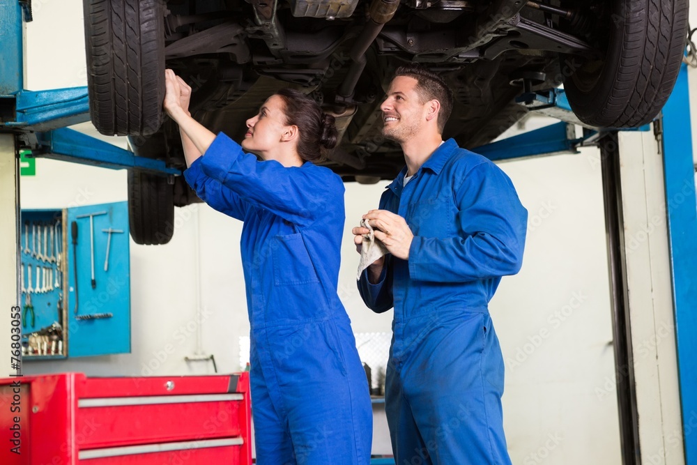 Team of mechanics working together Team of mechanics working together