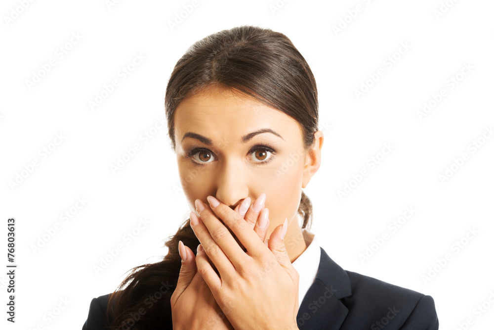 Portrait of shocked businesswoman covering mouth Portrait of shocked businesswoman covering mouth