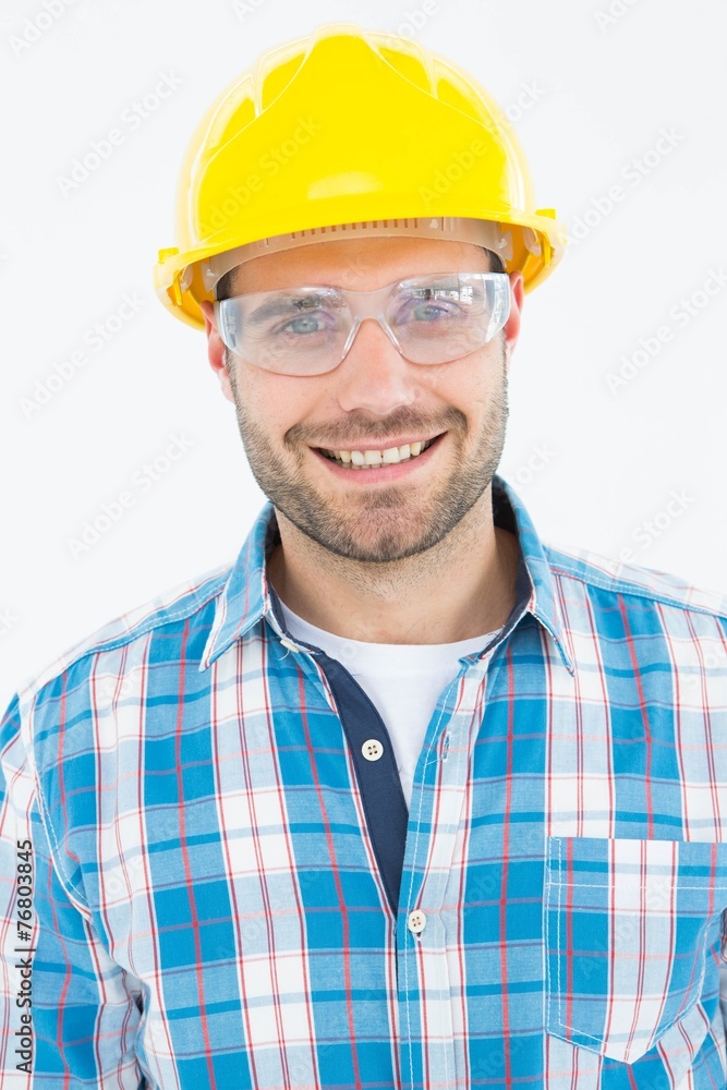 Confident repairman wearing protective glasses Confident repairman wearing protective glasses