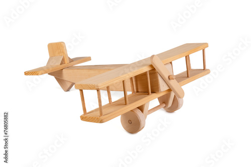 wooden airplane toy isolated on white background photo