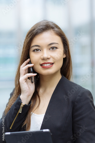 Businesswoman using mobile phone