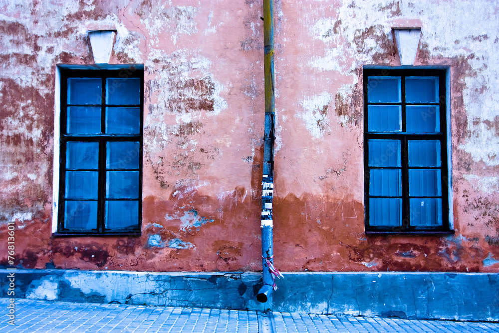 Cracked wall with two windows