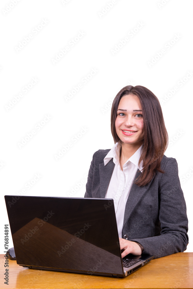 young business woman at a table with a laptop young business woman at a table with a laptop