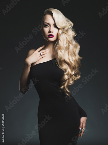 Slika na platnu Elegant blonde on black background