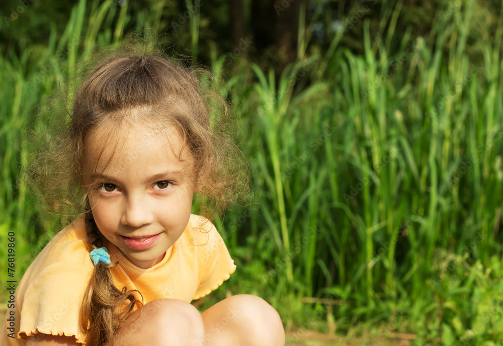 Healthy Smiling little Girl in Green Grass. Healthy Smiling little Girl in Green Grass.