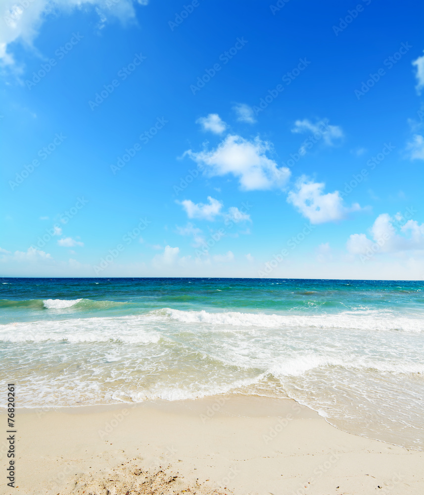 Poetto beach under a blue sky