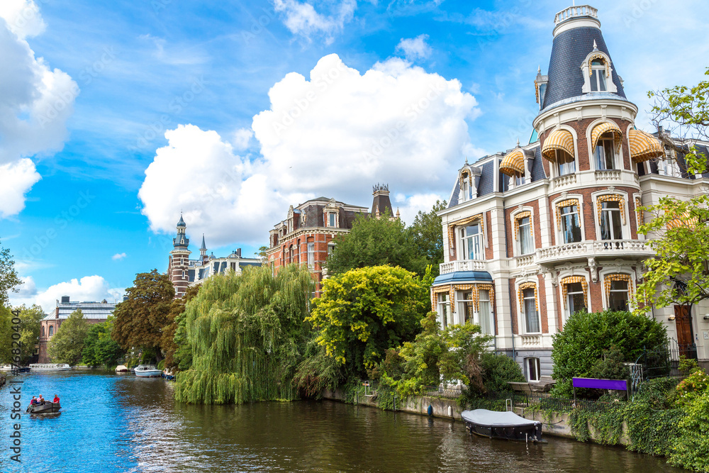 Fototapeta premium Amsterdam canals and boats, Holland, Netherlands.