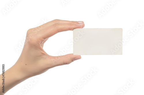 Woman holding blank business card in hand.