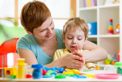 child boy and mother playin...