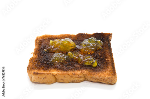 Burnt toast slice isolated on white background