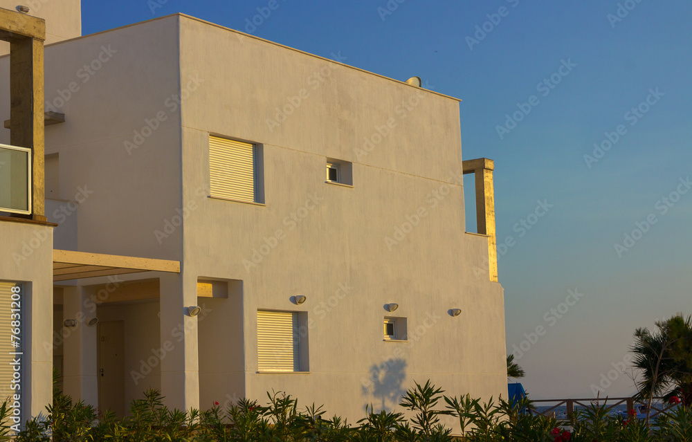 Color white modern house at sunset