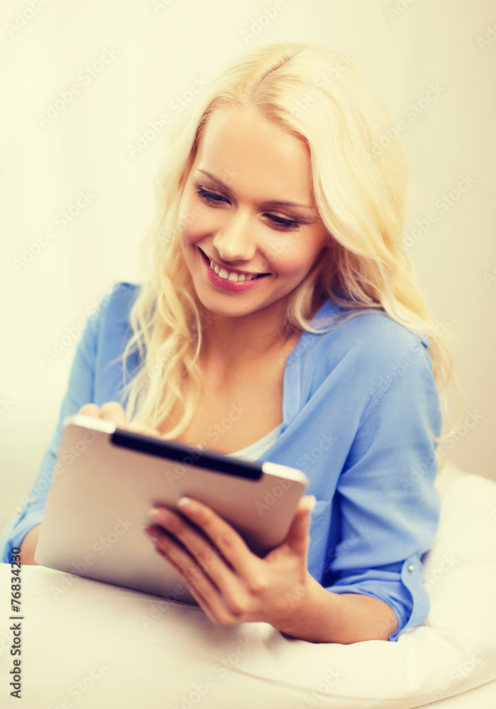 smiling woman with tablet pc computer at home smiling woman with tablet pc computer at home
