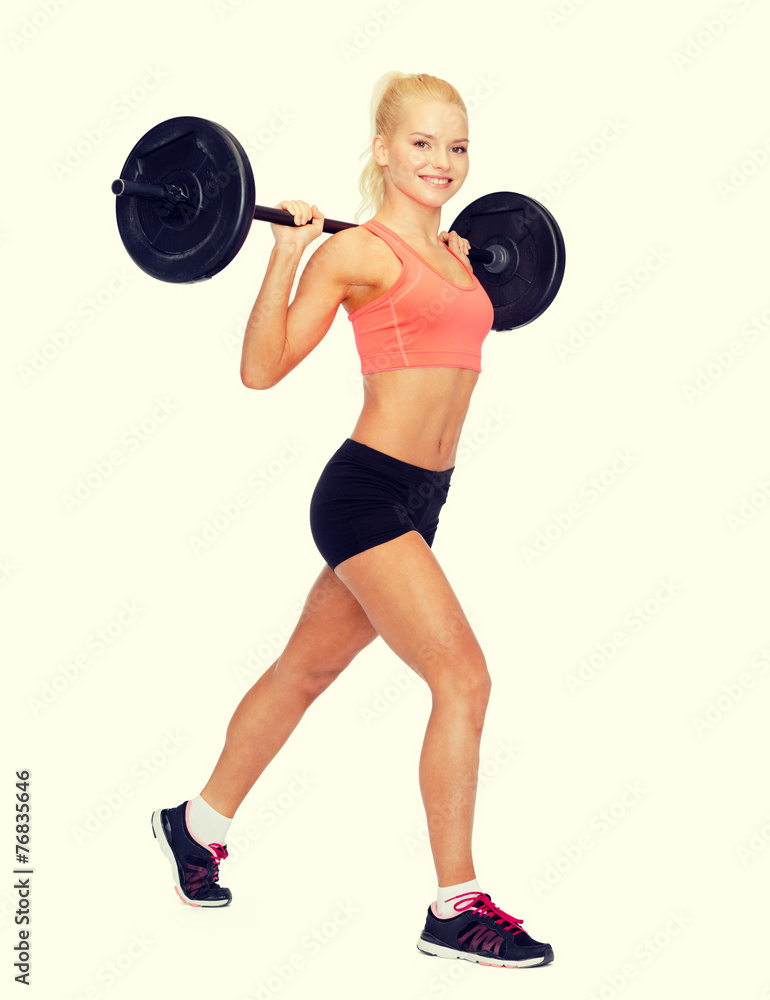 smiling sporty woman exercising with barbell smiling sporty woman exercising with barbell